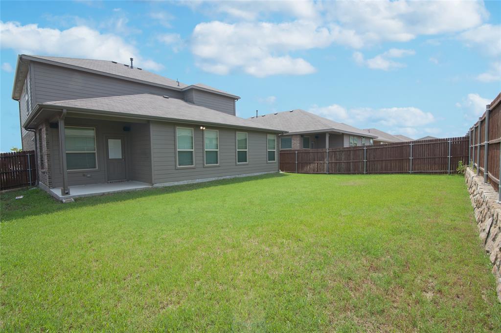 1021 Gillespie Drive Fort Worth, TX 76247 - Photo 35 of 38 a view of a house with a garden
