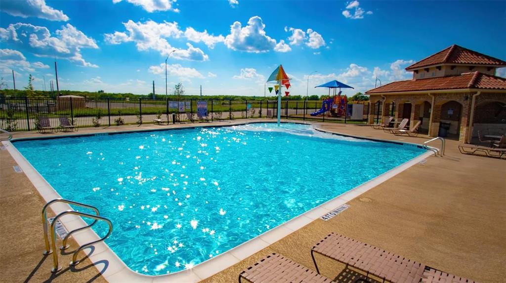 1021 Gillespie Drive Fort Worth, TX 76247 - Photo 37 of 38 a view of a swimming pool with outdoor seating