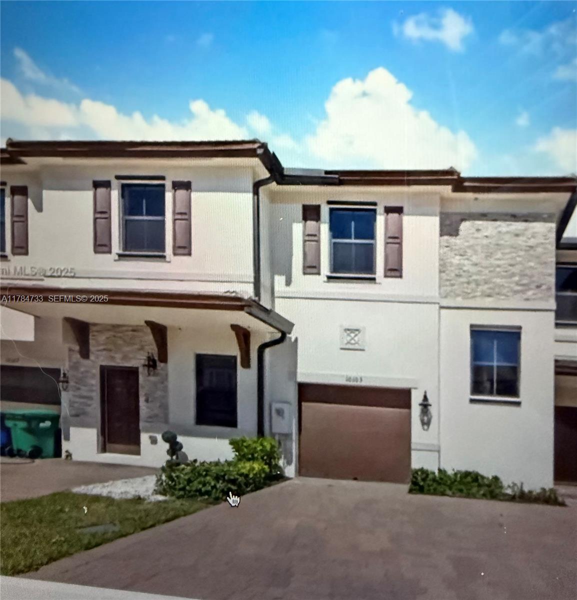 10226 Southwest 231st Lane Miami, FL 33190 - Photo 1 of 1 front view of a house with a yard
