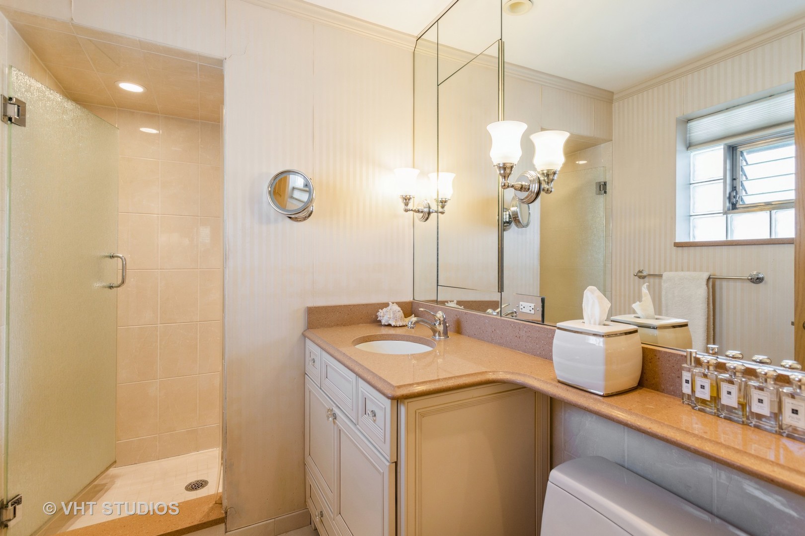 4545 North Long Avenue, Unit 3D Chicago, IL 60630 - Photo 13 of 19 a bathroom with a granite countertop sink a toilet a mirror and shower