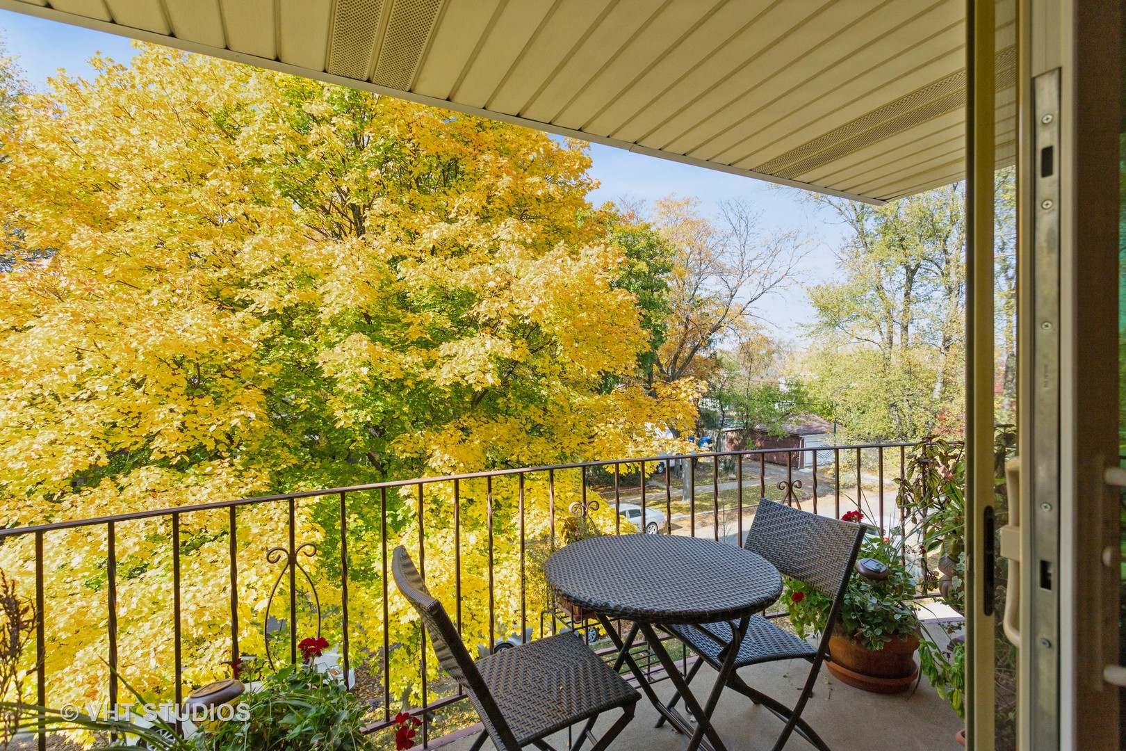 4545 North Long Avenue, Unit 3D Chicago, IL 60630 - Photo 18 of 19 a view of a balcony with table and chairs