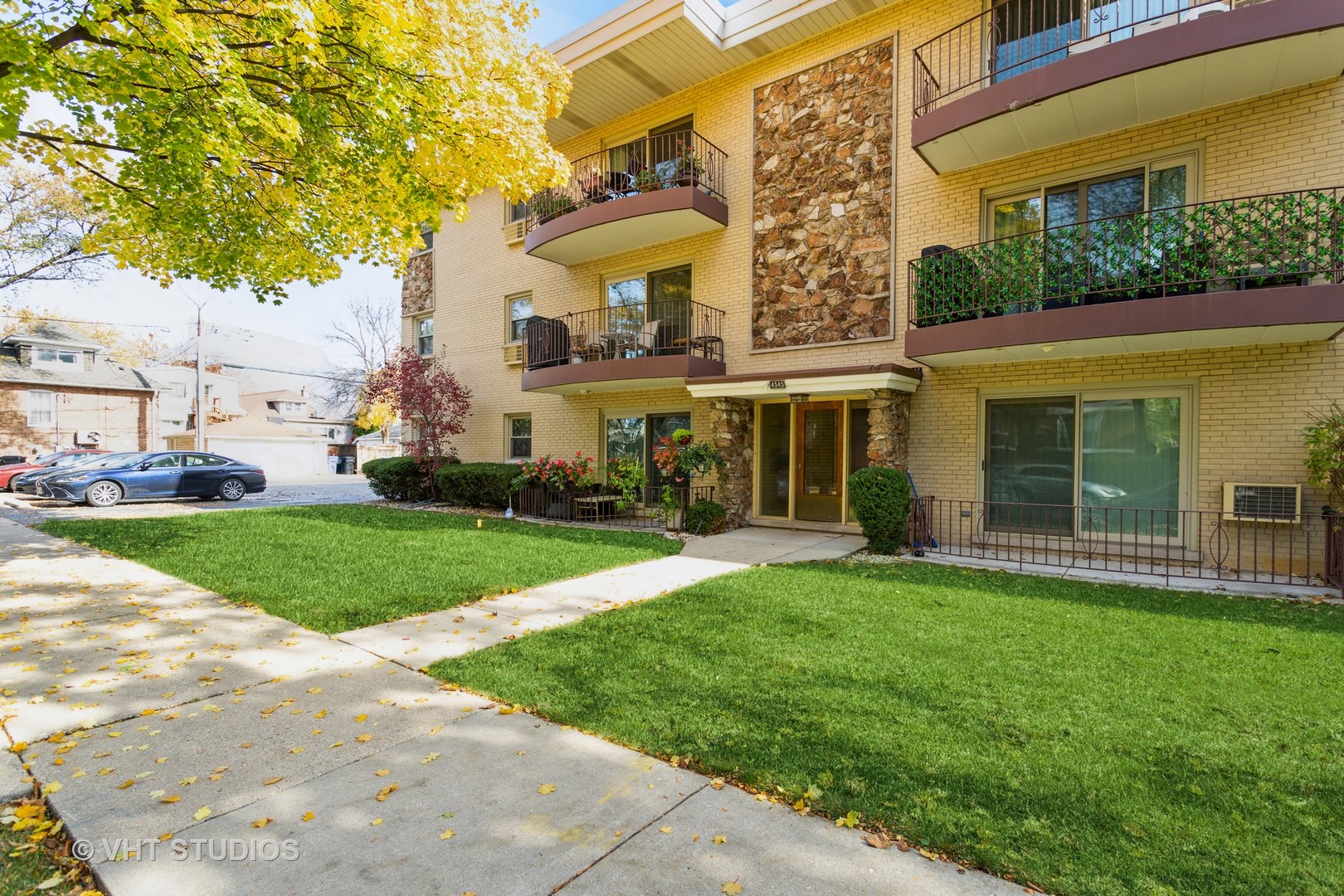 4545 North Long Avenue, Unit 3D Chicago, IL 60630 - Photo 2 of 19 a view of a building with a yard