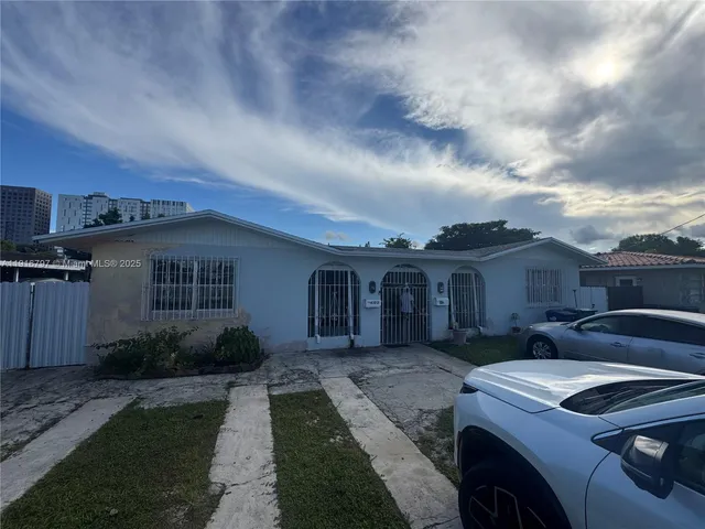 a view of a house with a sink and backyard
