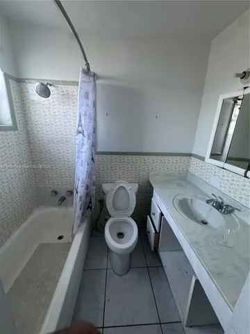 a view of a livingroom with furniture and a fireplace