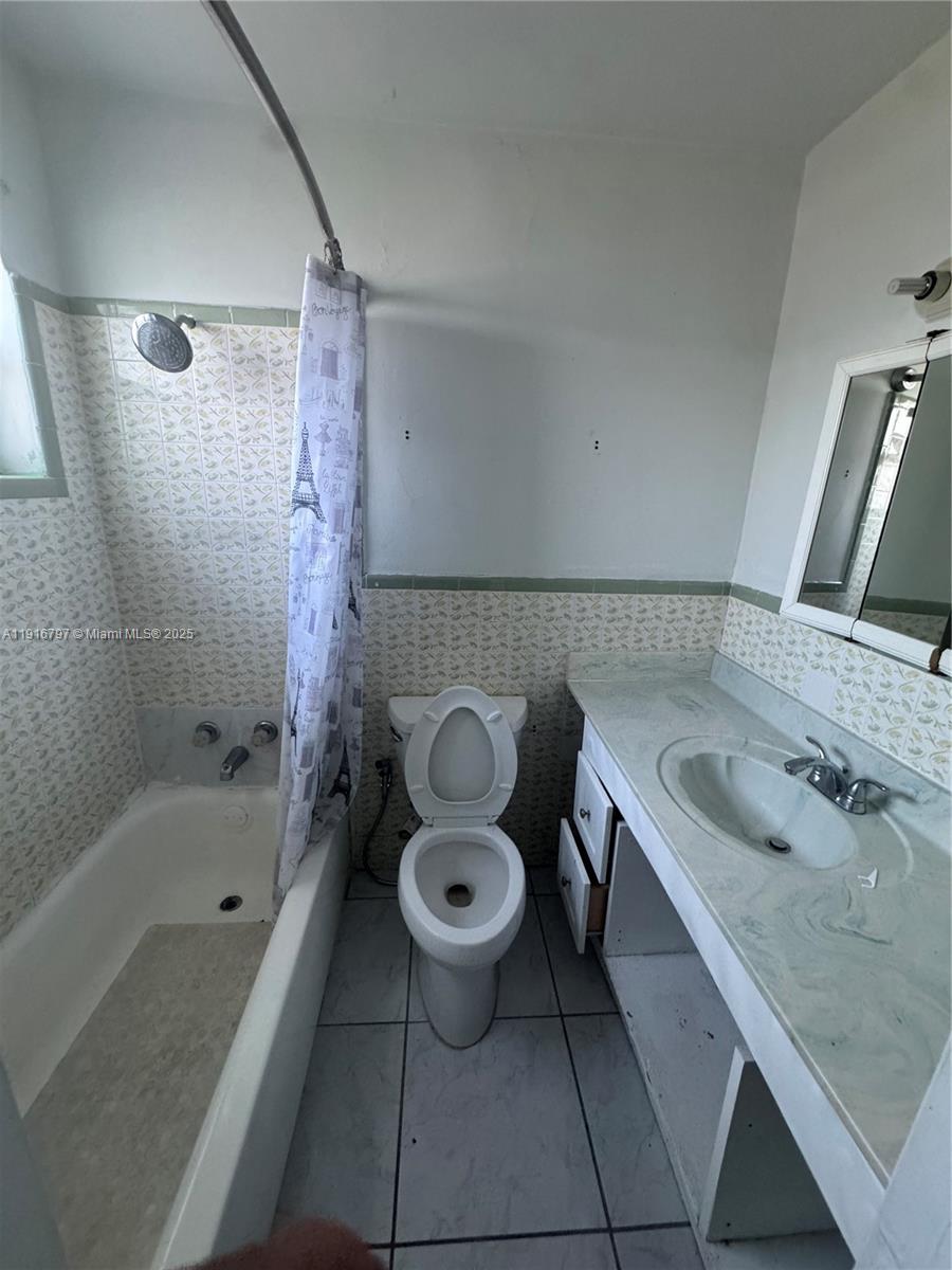 11012 Southwest 4th Street Sweetwater, FL 33174 - Photo 11 of 19 a bathroom with a sink a toilet and shower