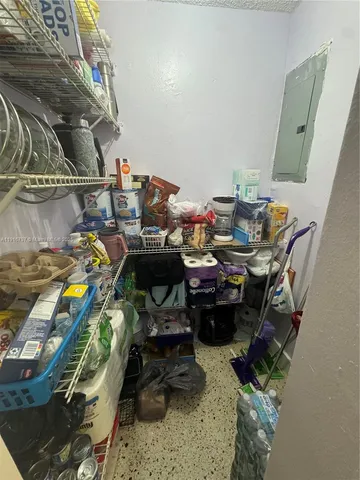 a bathroom with a toilet and a mirror