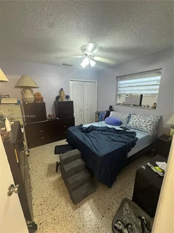 a bathroom with a sink a toilet and a shower a mirror