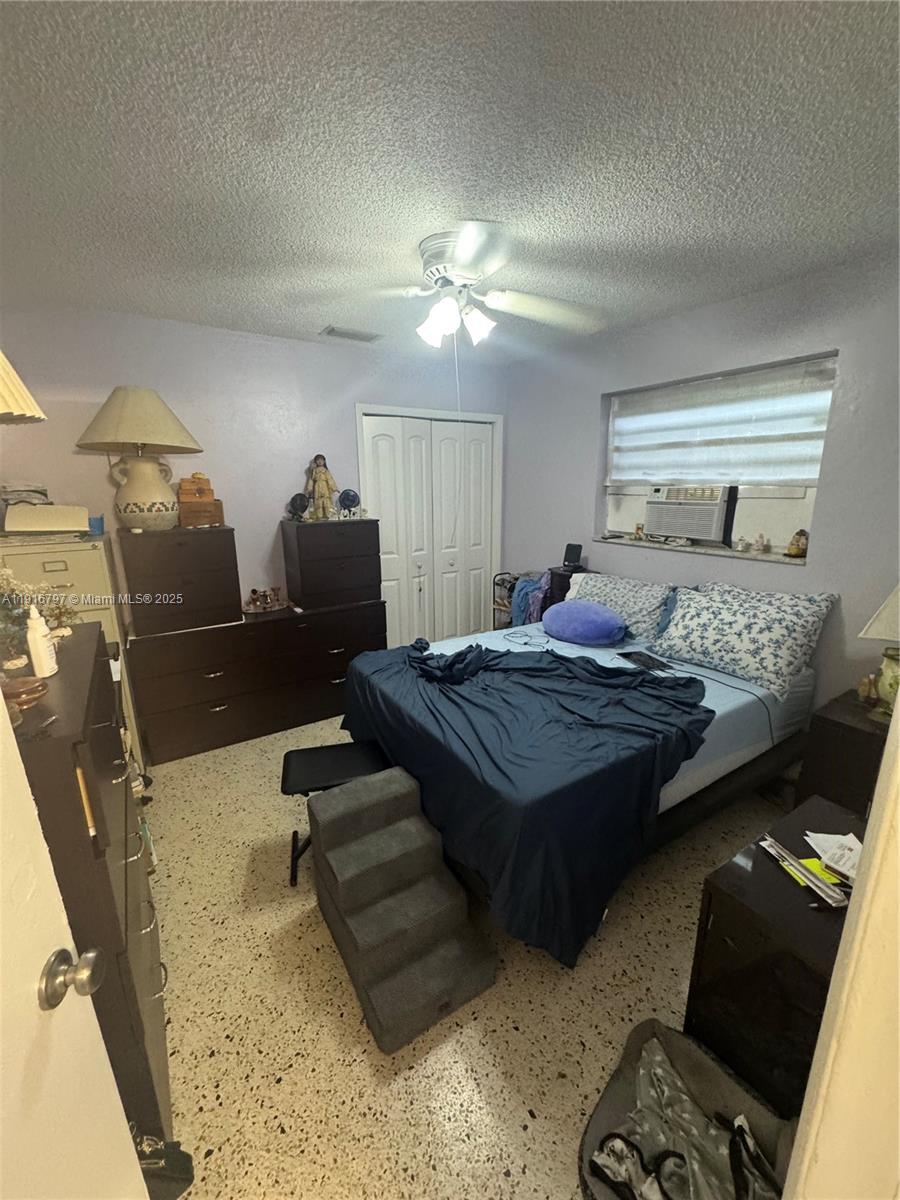 11012 Southwest 4th Street Sweetwater, FL 33174 - Photo 16 of 19 a bedroom with a bed and window