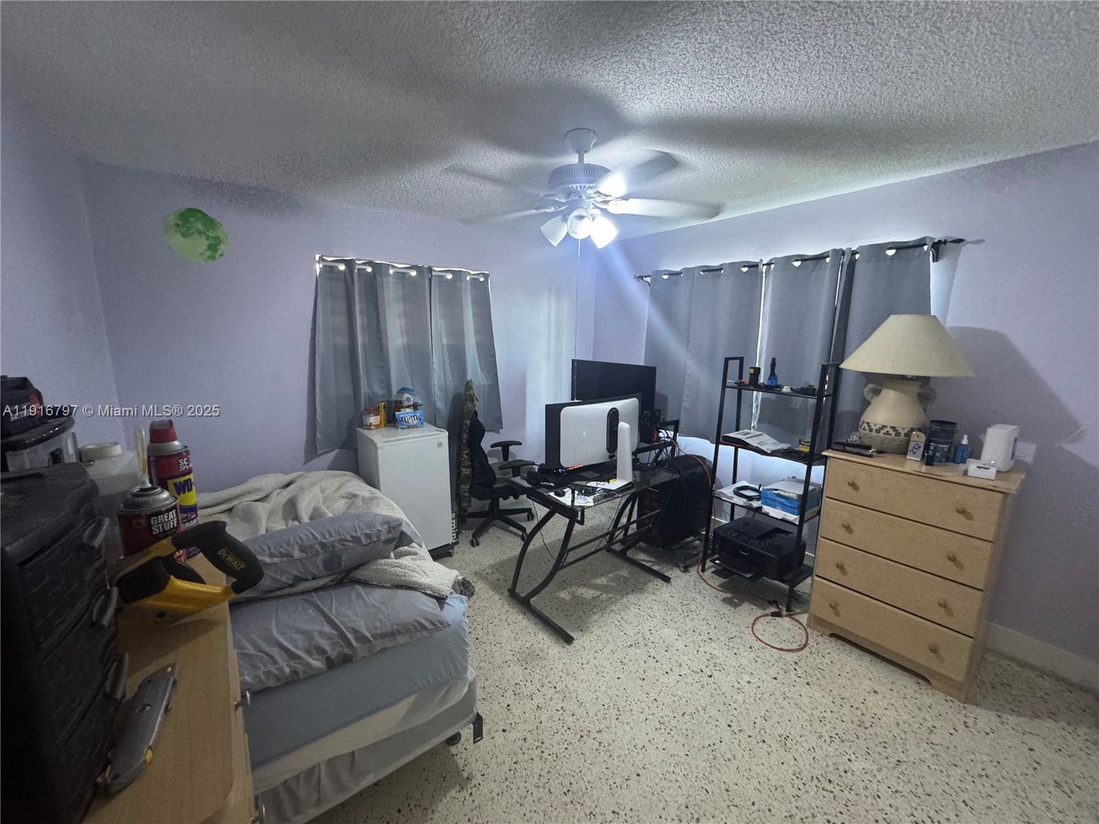 11012 Southwest 4th Street Sweetwater, FL 33174 - Photo 18 of 19 a living room with furniture and a chandelier