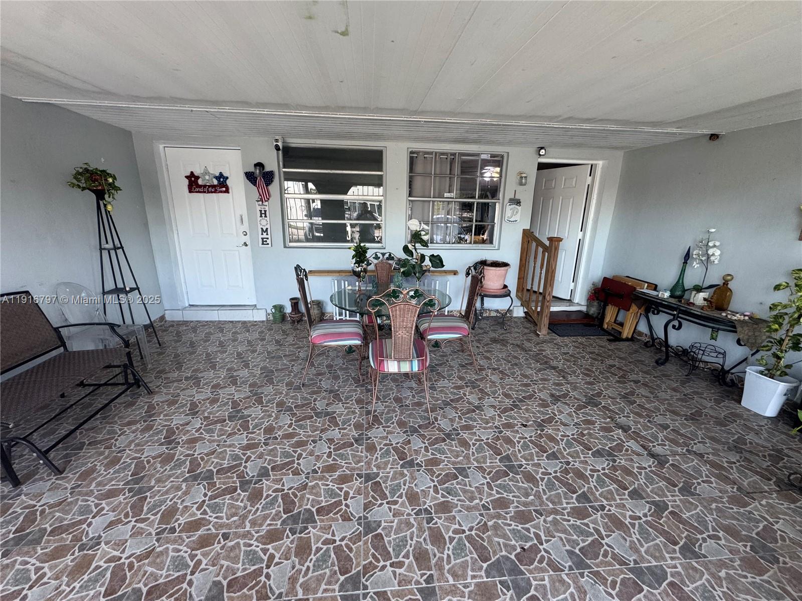 11012 Southwest 4th Street Sweetwater, FL 33174 - Photo 2 of 19 a living room with furniture and a flat screen tv