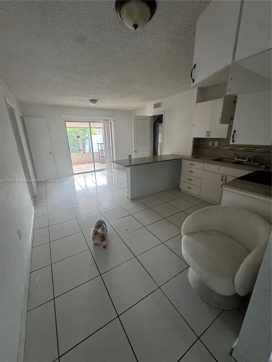 11012 Southwest 4th Street Sweetwater, FL 33174 - Photo 5 of 19 a living room with furniture and a window