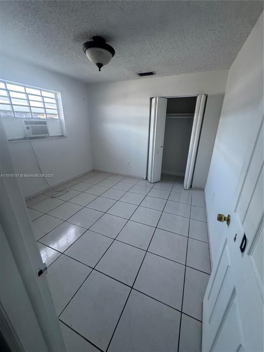 11012 Southwest 4th Street Sweetwater, FL 33174 - Photo 7 of 19 a view of an empty room and window