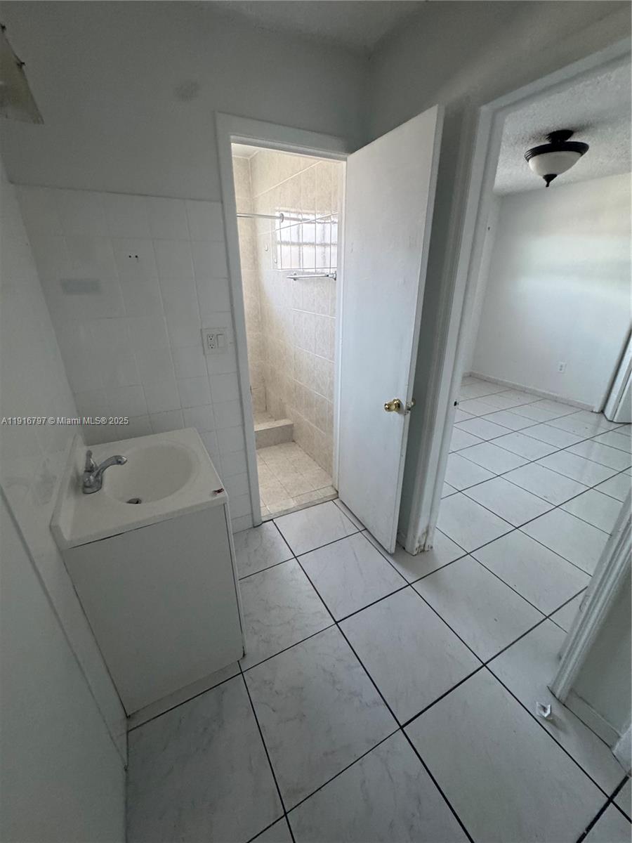 11012 Southwest 4th Street Sweetwater, FL 33174 - Photo 8 of 19 a bathroom with a bathtub