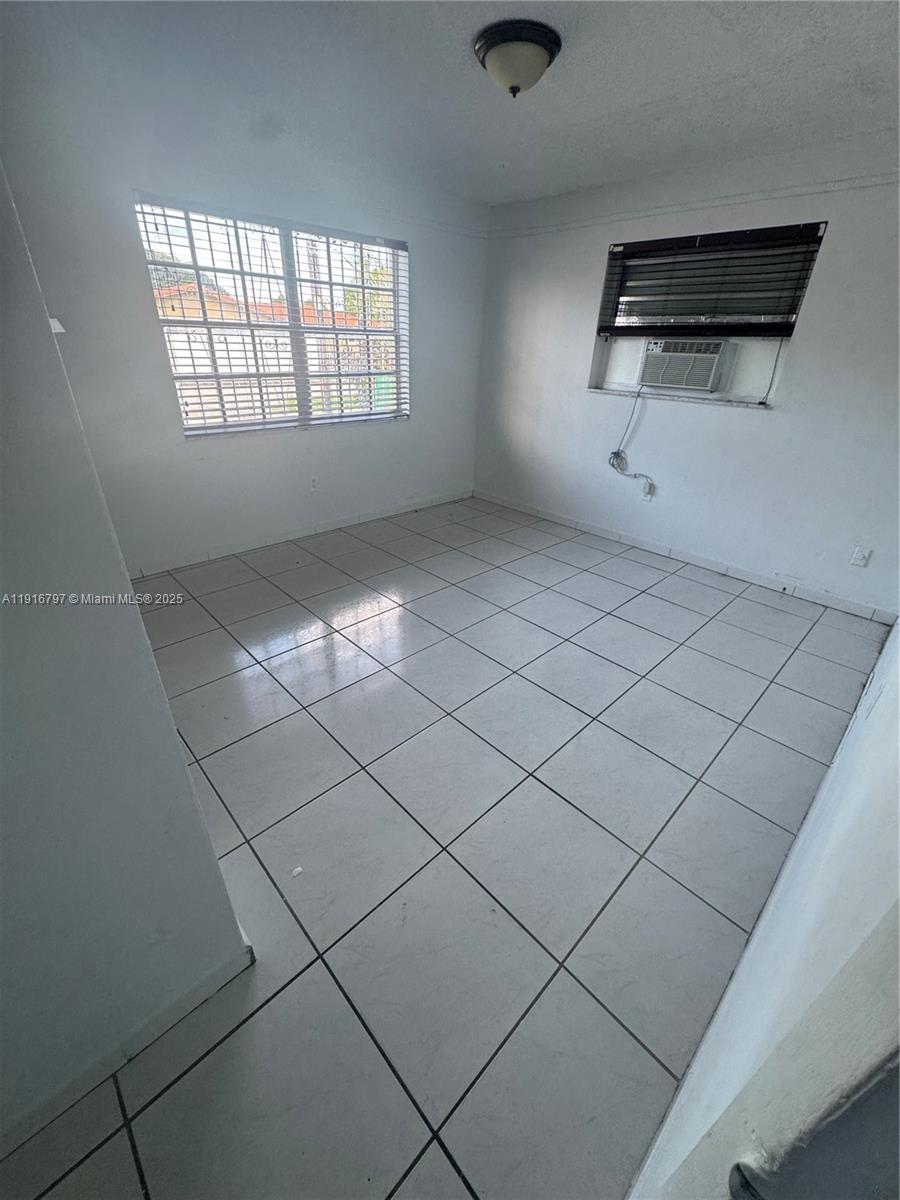 11012 Southwest 4th Street Sweetwater, FL 33174 - Photo 9 of 19 a view of an empty room and window