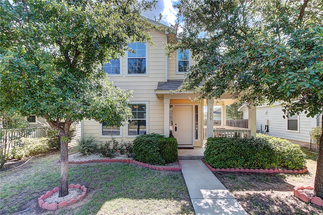 9219 Rowlands Sayle Road Austin, TX 78744 - Photo 1 of 1 a front view of a house with garden