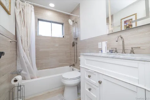 a bathroom with a toilet a sink and a bathtub