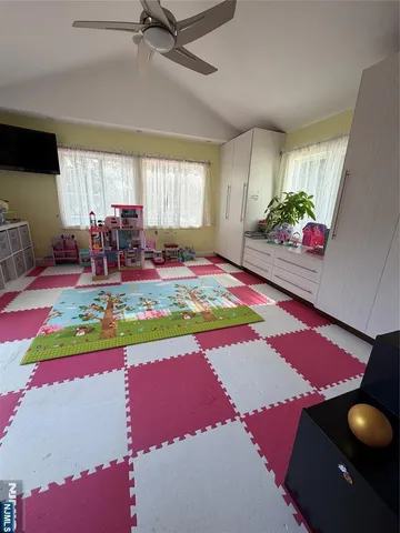 a bedroom with furniture and a wooden floor