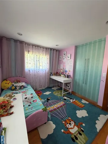 a bedroom with a bed and a table in it