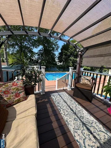 a view of a balcony with chairs