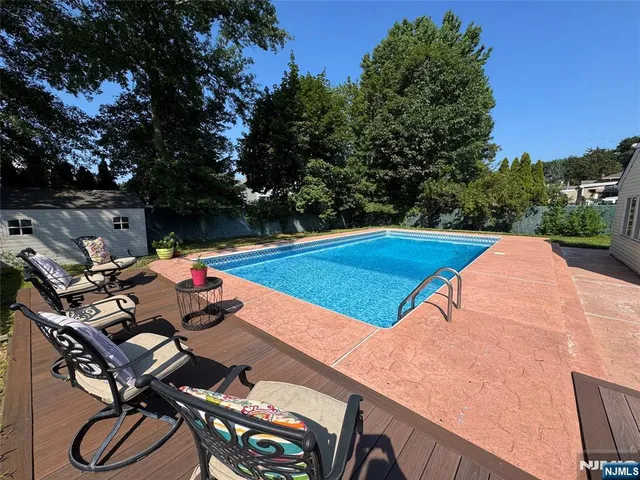 a view of swimming pool with lounge chair