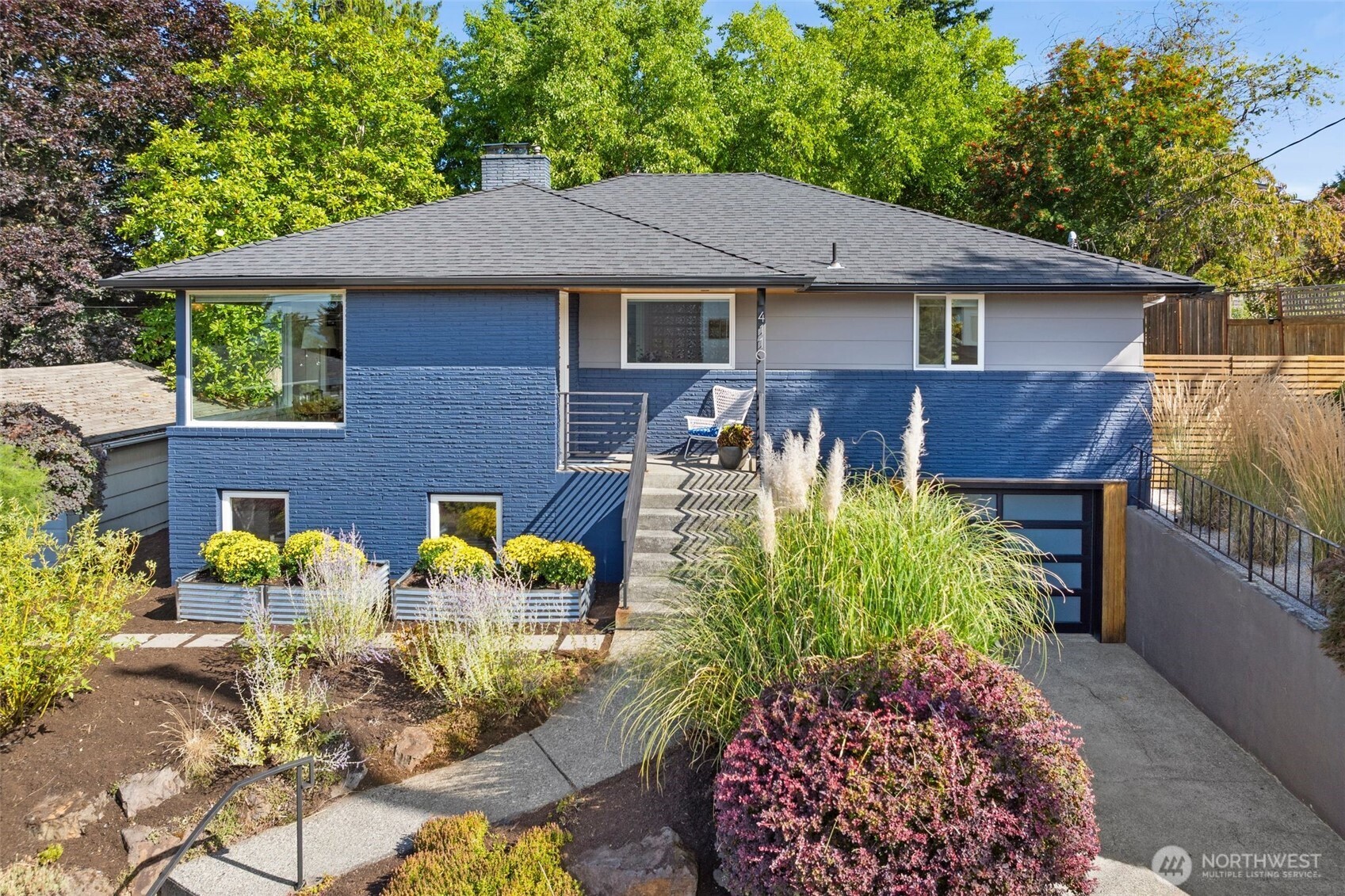 a front view of a house with garden
