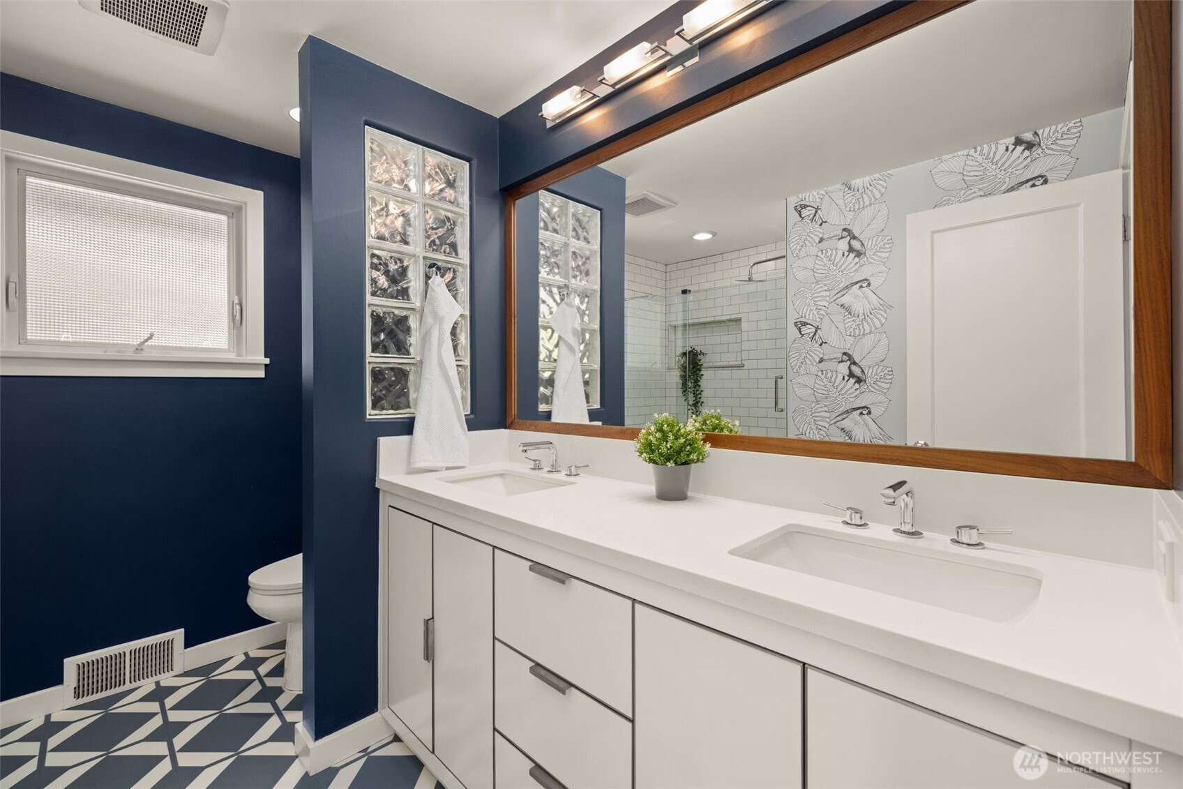 4110 Southwest Rose Street Seattle, WA 98136 - Photo 16 of 39 a bathroom with a sink double vanity and a mirror