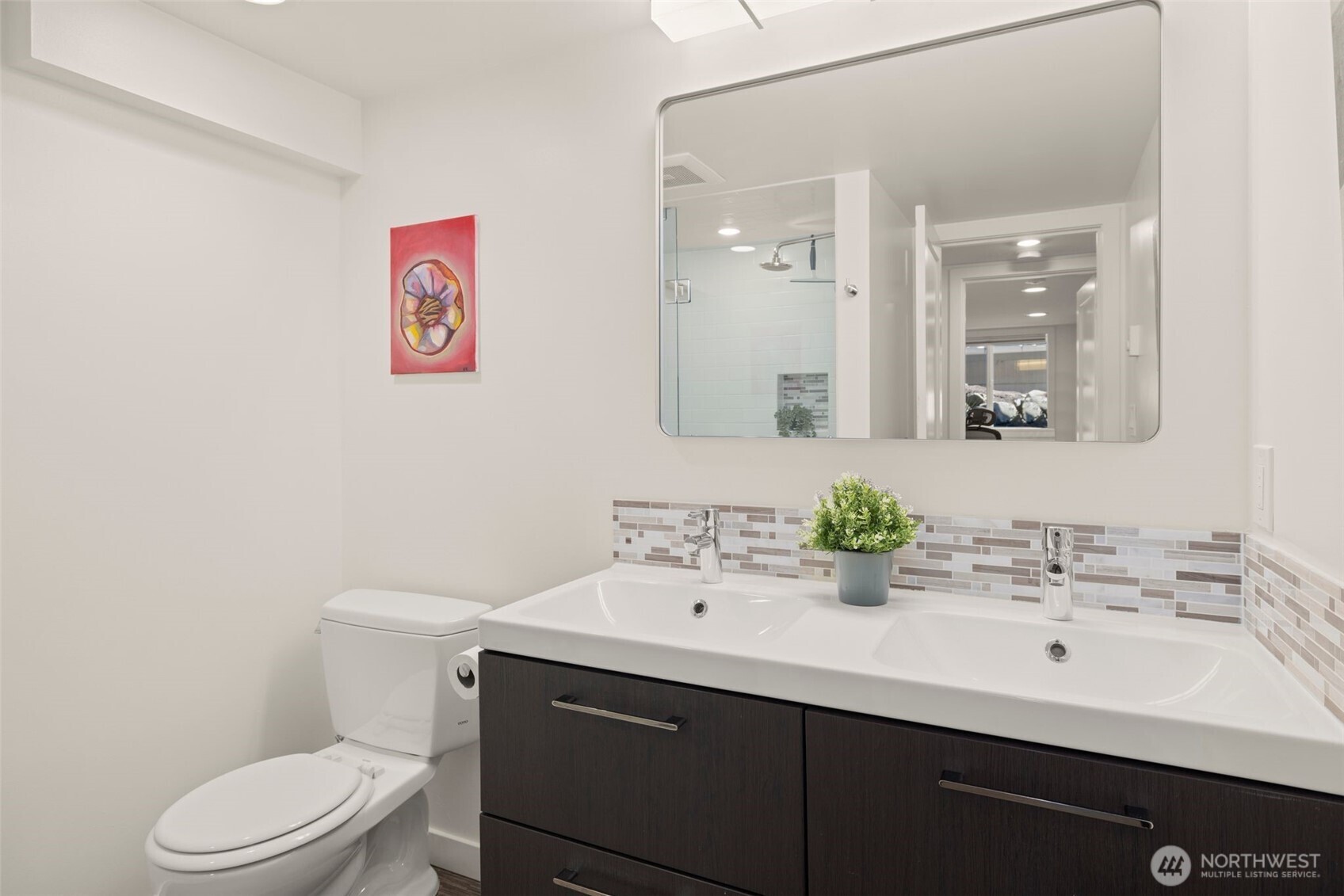 4110 Southwest Rose Street Seattle, WA 98136 - Photo 22 of 39 a bathroom with a sink mirror and toilet