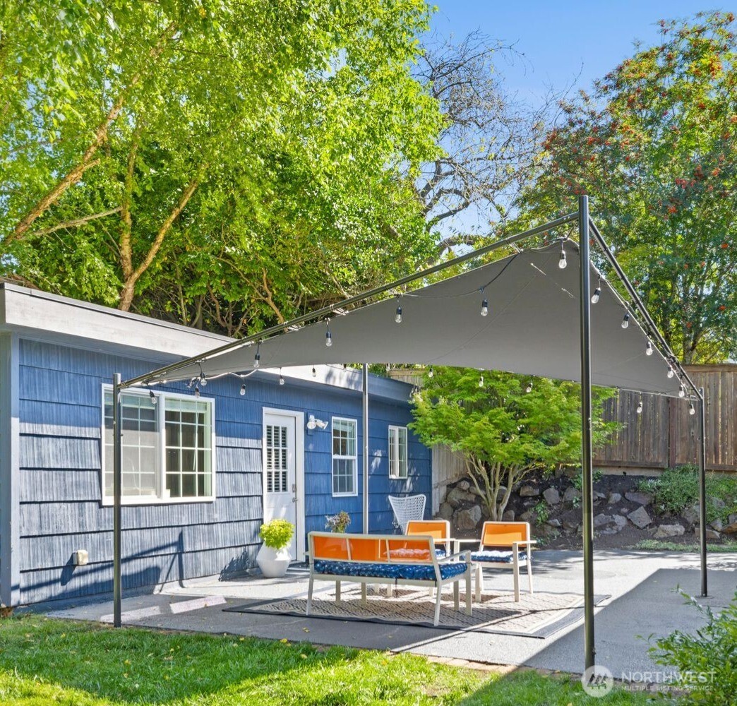 4110 Southwest Rose Street Seattle, WA 98136 - Photo 23 of 39 a view of a house with backyard porch and sitting area