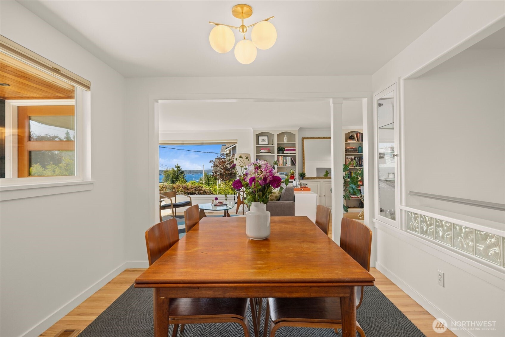 4110 Southwest Rose Street Seattle, WA 98136 - Photo 9 of 39 a view of a dining room with furniture window and wooden floor