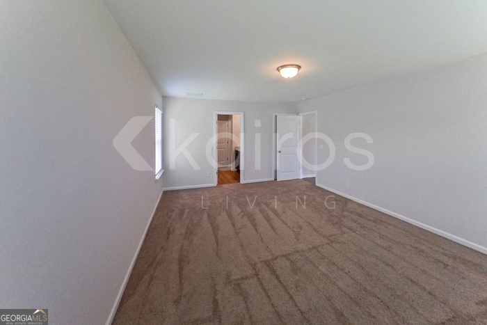 105 Bluff Road Springfield, GA 31329 - Photo 16 of 21 a view of empty room with wooden floor