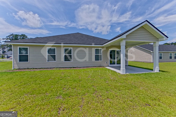 105 Bluff Road Springfield, GA 31329 - Photo 19 of 21 a view of a house with a backyard