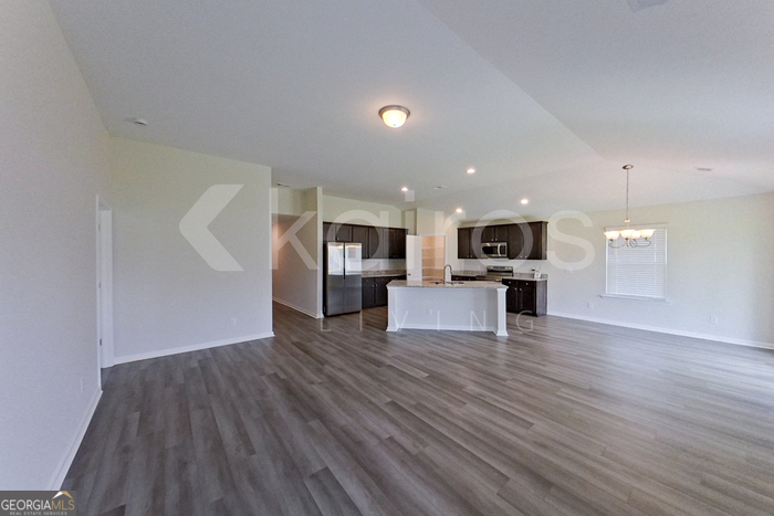 105 Bluff Road Springfield, GA 31329 - Photo 3 of 21 a view of kitchen with furniture and wooden floor
