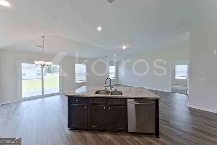 105 Bluff Road Springfield, GA 31329 - Photo 6 of 21 a kitchen with a sink cabinets and wooden floor
