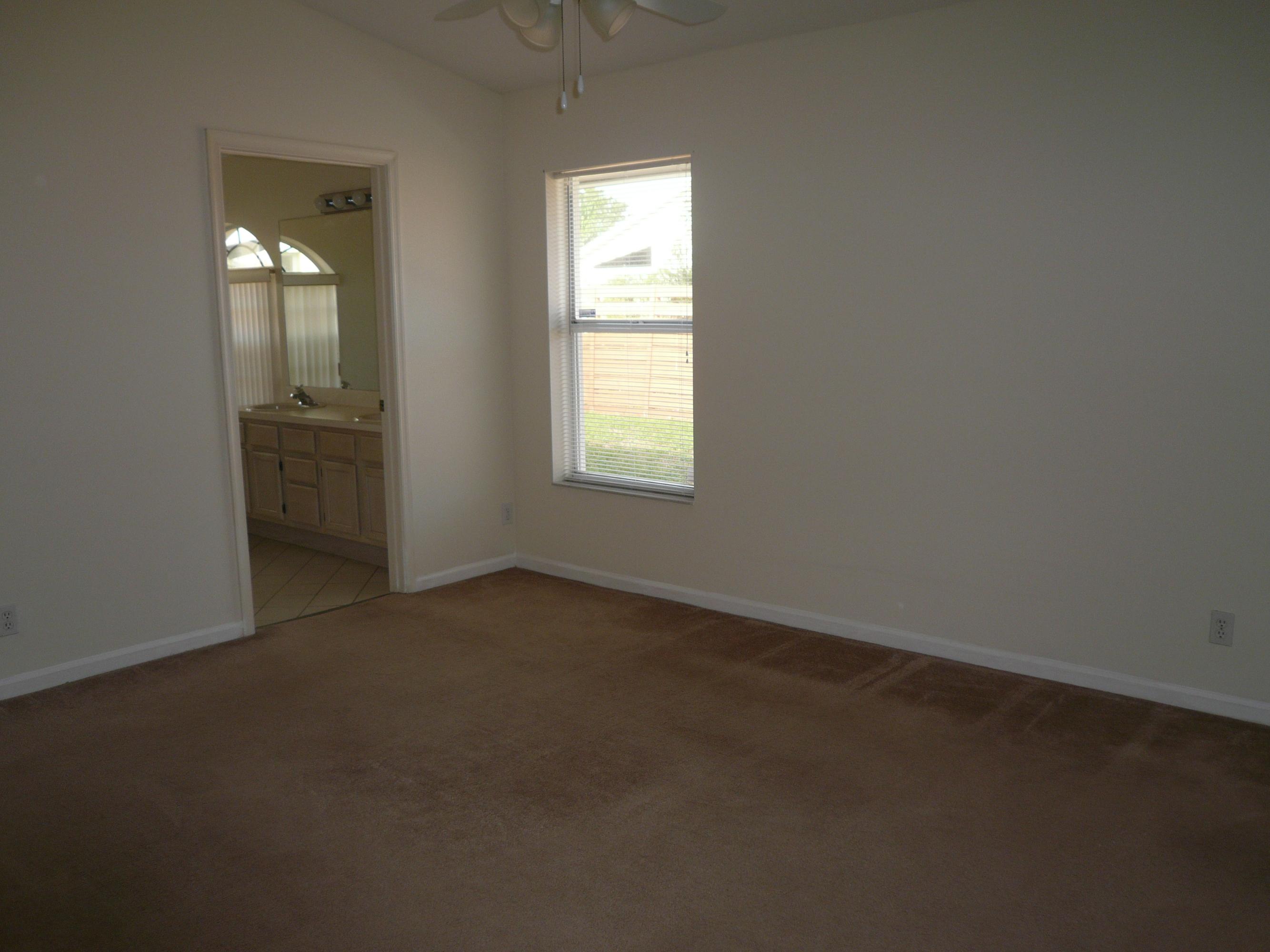 6287 Garrett Street Jupiter, FL 33458 - Photo 14 of 17 an empty room that has a window in it