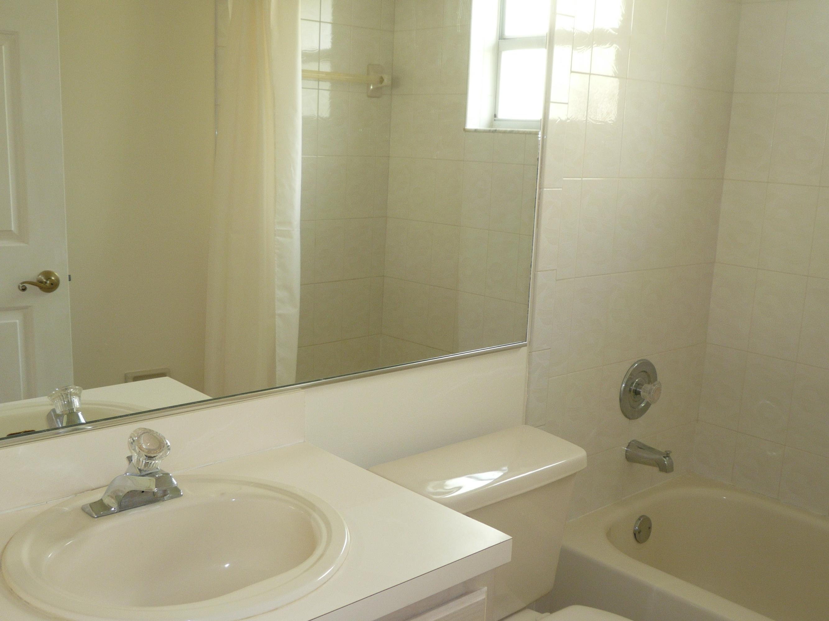 6287 Garrett Street Jupiter, FL 33458 - Photo 15 of 17 a bathroom with a sink a toilet and shower