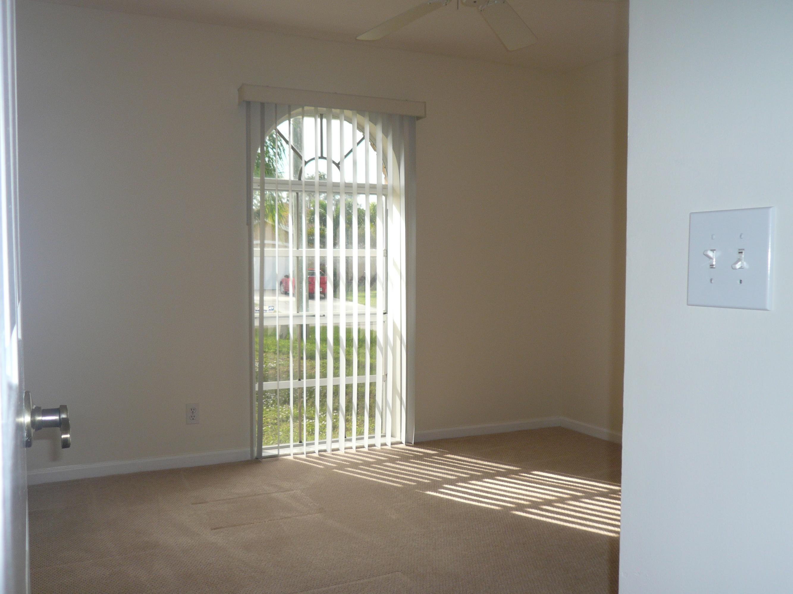 6287 Garrett Street Jupiter, FL 33458 - Photo 16 of 17 a view of empty room with windows