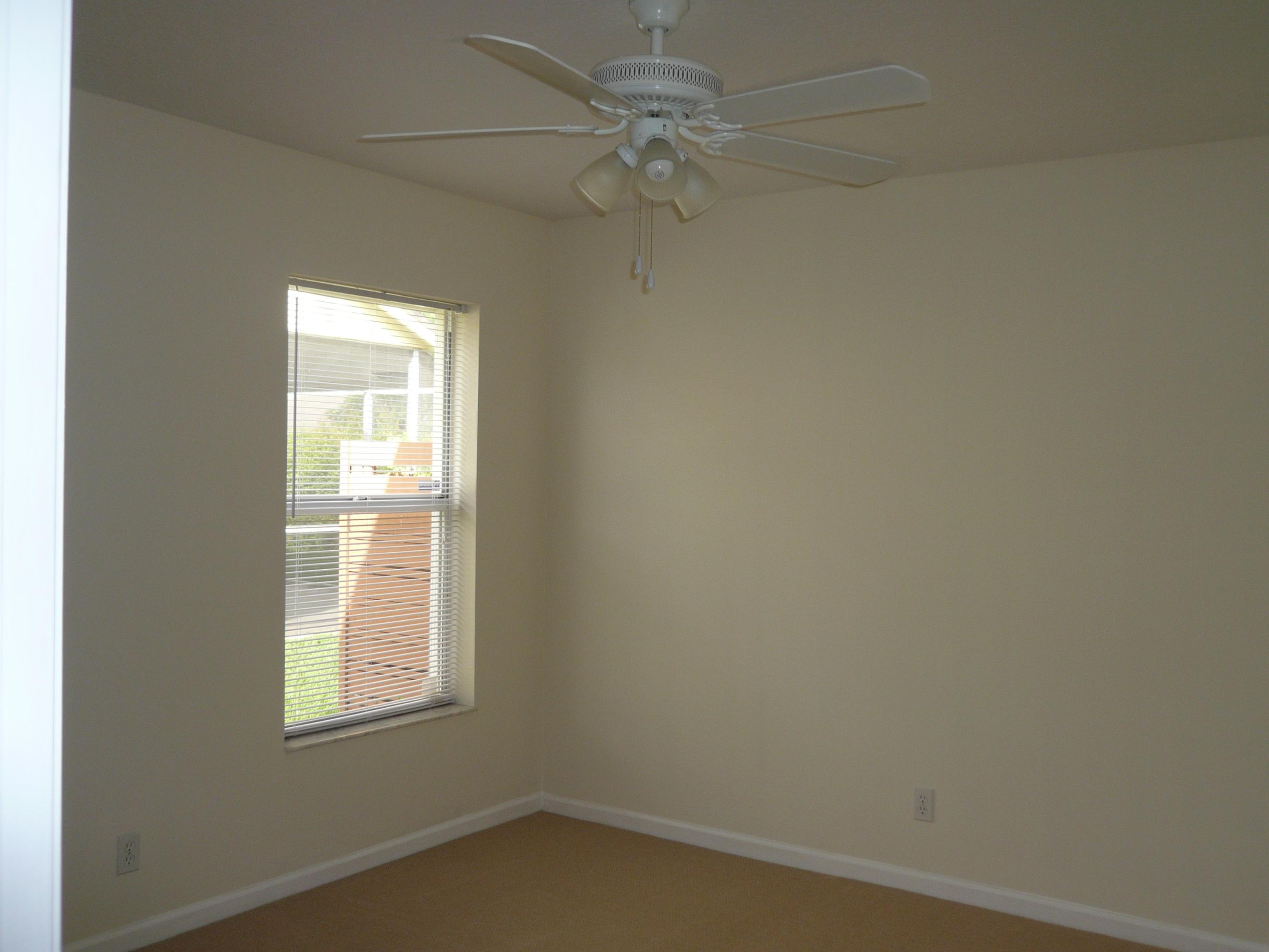 6287 Garrett Street Jupiter, FL 33458 - Photo 17 of 17 an empty room with a window