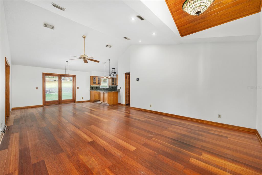 12861 Southwest 45th Lane Road Ocala, FL 34481 - Photo 12 of 73 a view of empty room with wooden floor