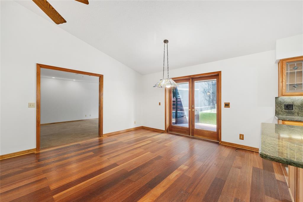 12861 Southwest 45th Lane Road Ocala, FL 34481 - Photo 14 of 73 a view of an empty room with window and wooden floor