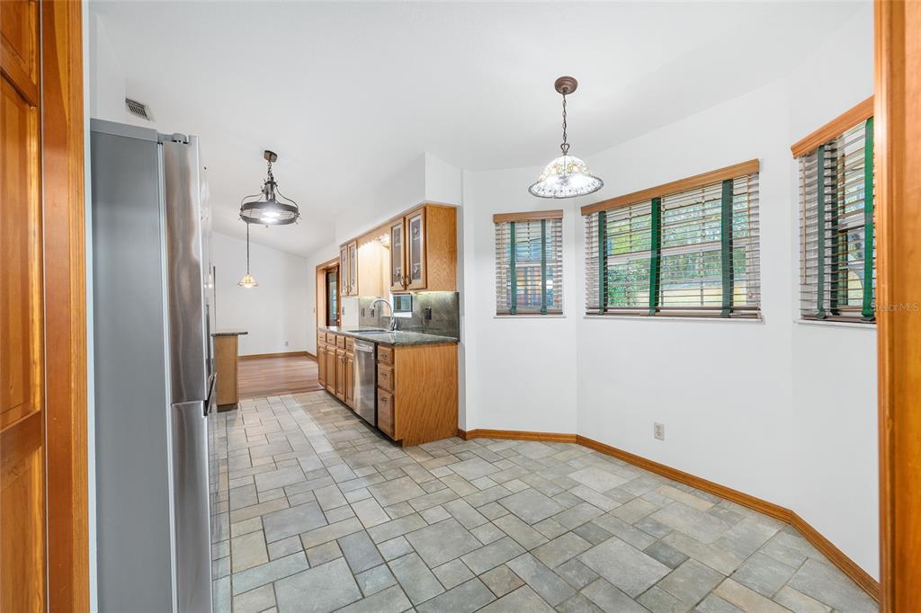 12861 Southwest 45th Lane Road Ocala, FL 34481 - Photo 21 of 73 a view of a kitchen with a sink and windows