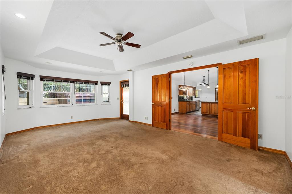 12861 Southwest 45th Lane Road Ocala, FL 34481 - Photo 26 of 73 a view of empty room with wooden floor and fan