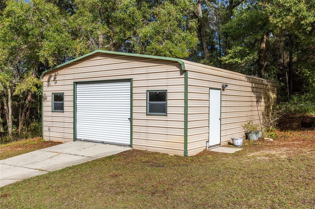 12861 Southwest 45th Lane Road Ocala, FL 34481 - Photo 47 of 73 a front view of a house with a yard