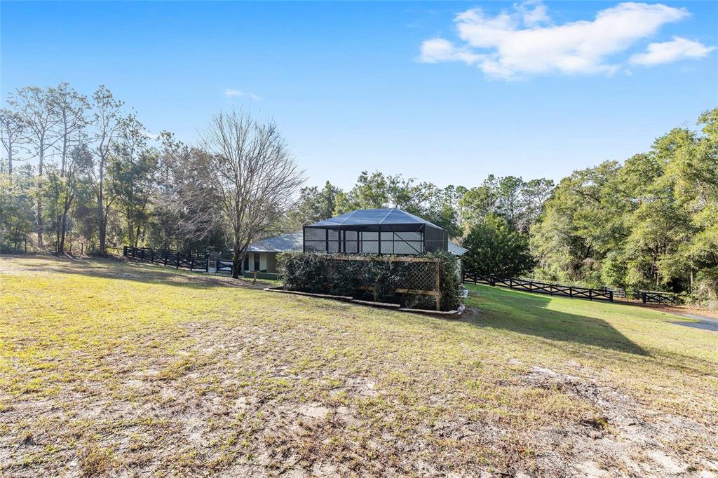 12861 Southwest 45th Lane Road Ocala, FL 34481 - Photo 52 of 73 a view of a house with a yard