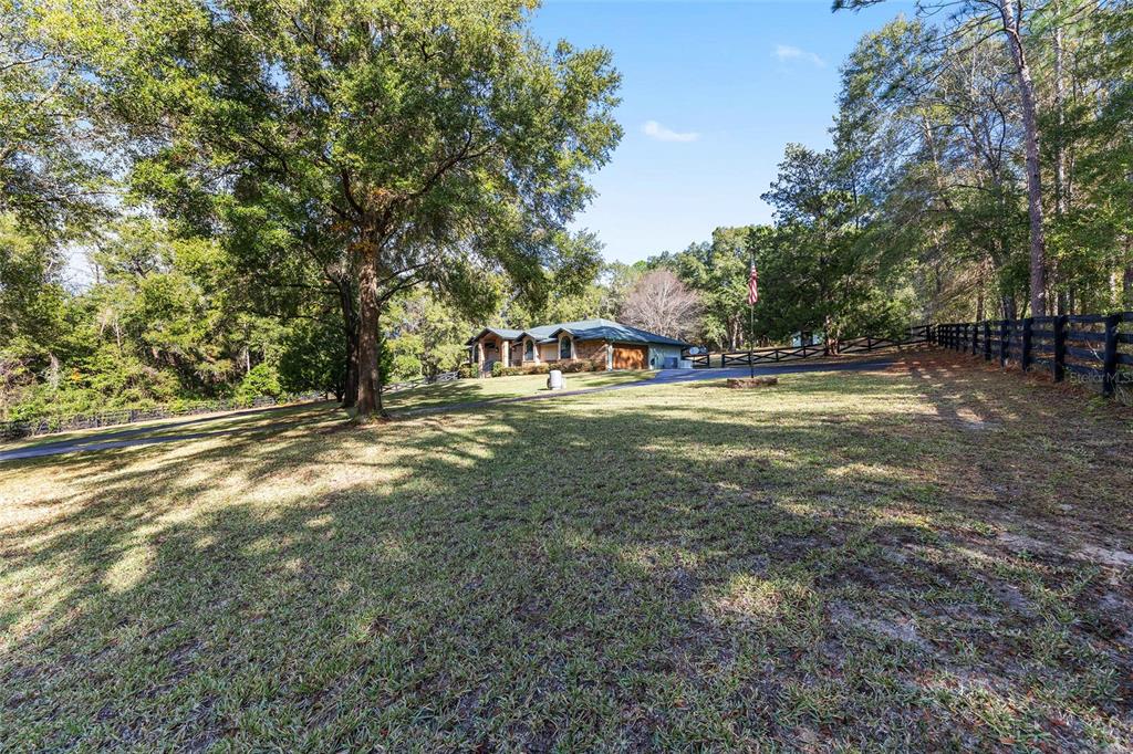 12861 Southwest 45th Lane Road Ocala, FL 34481 - Photo 55 of 73 a view of a field with trees in the background