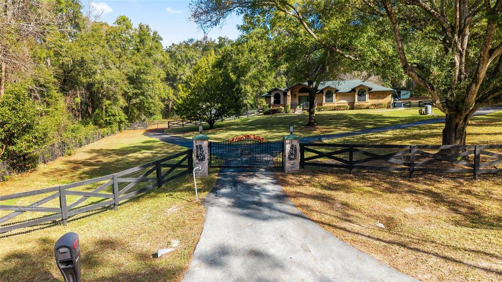 12861 Southwest 45th Lane Road Ocala, FL 34481 - Photo 56 of 73 a backyard of a house with table and chairs