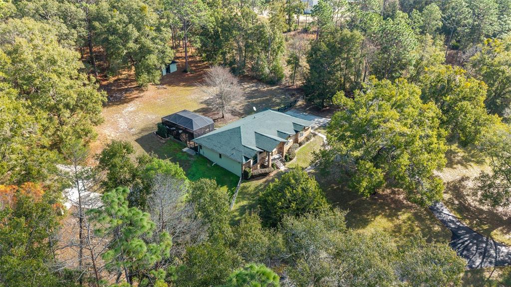 12861 Southwest 45th Lane Road Ocala, FL 34481 - Photo 57 of 73 an aerial view of a house with yard swimming pool and outdoor seating