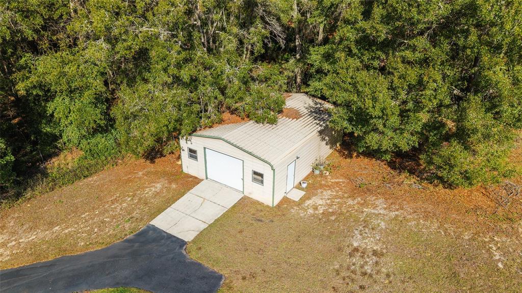 12861 Southwest 45th Lane Road Ocala, FL 34481 - Photo 72 of 73 a view of a yard with an outdoor space