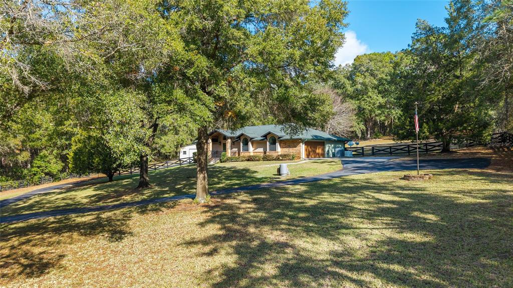 12861 Southwest 45th Lane Road Ocala, FL 34481 - Photo 73 of 73 a front view of a house with a yard