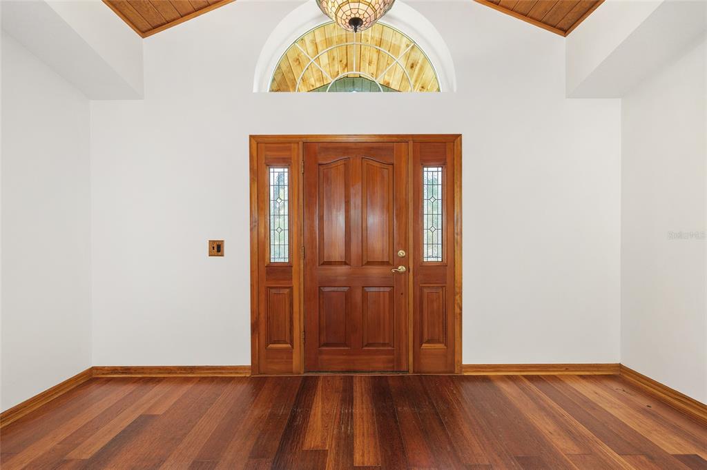 12861 Southwest 45th Lane Road Ocala, FL 34481 - Photo 9 of 73 a view of an entryway with wooden floor