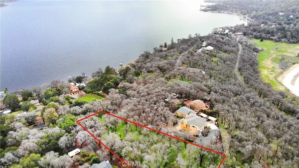a view of lake with a yard